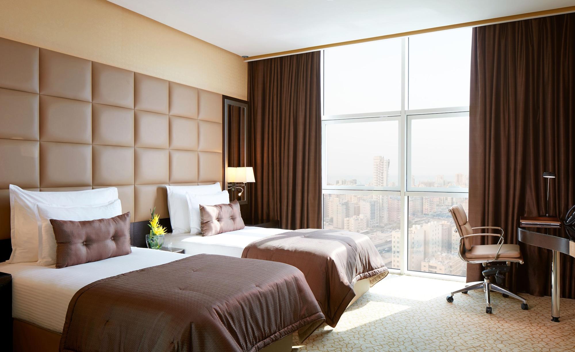 Millennium Hotel & Convention Centre Kuwait Кувейт Экстерьер фото A room at the hotel